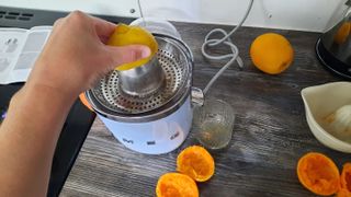 Smeg CJF01 citrus juicer juicing lemons
