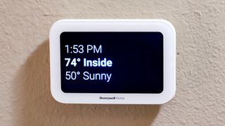 Honeywell Home X8S Smart Thermostat mounted to a hallway wall