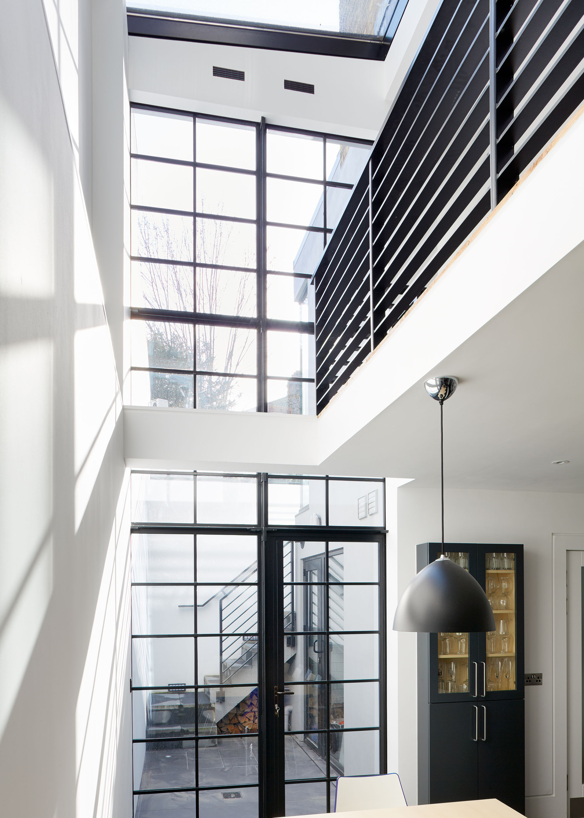 double height space with full height glazing and roof light
