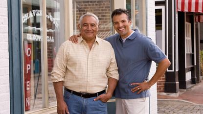 Father and Son in Front of Family Business