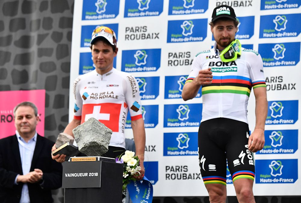 Peter Sagan waits to receive his cobble trophy
