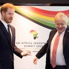 Prince Harry talks with Britain's Prime Minister Boris Johnson during a bilteral meeting at the UK-Africa Investment Summit in London on January 20, 2020. 