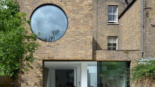 two storey extension with large circular window
