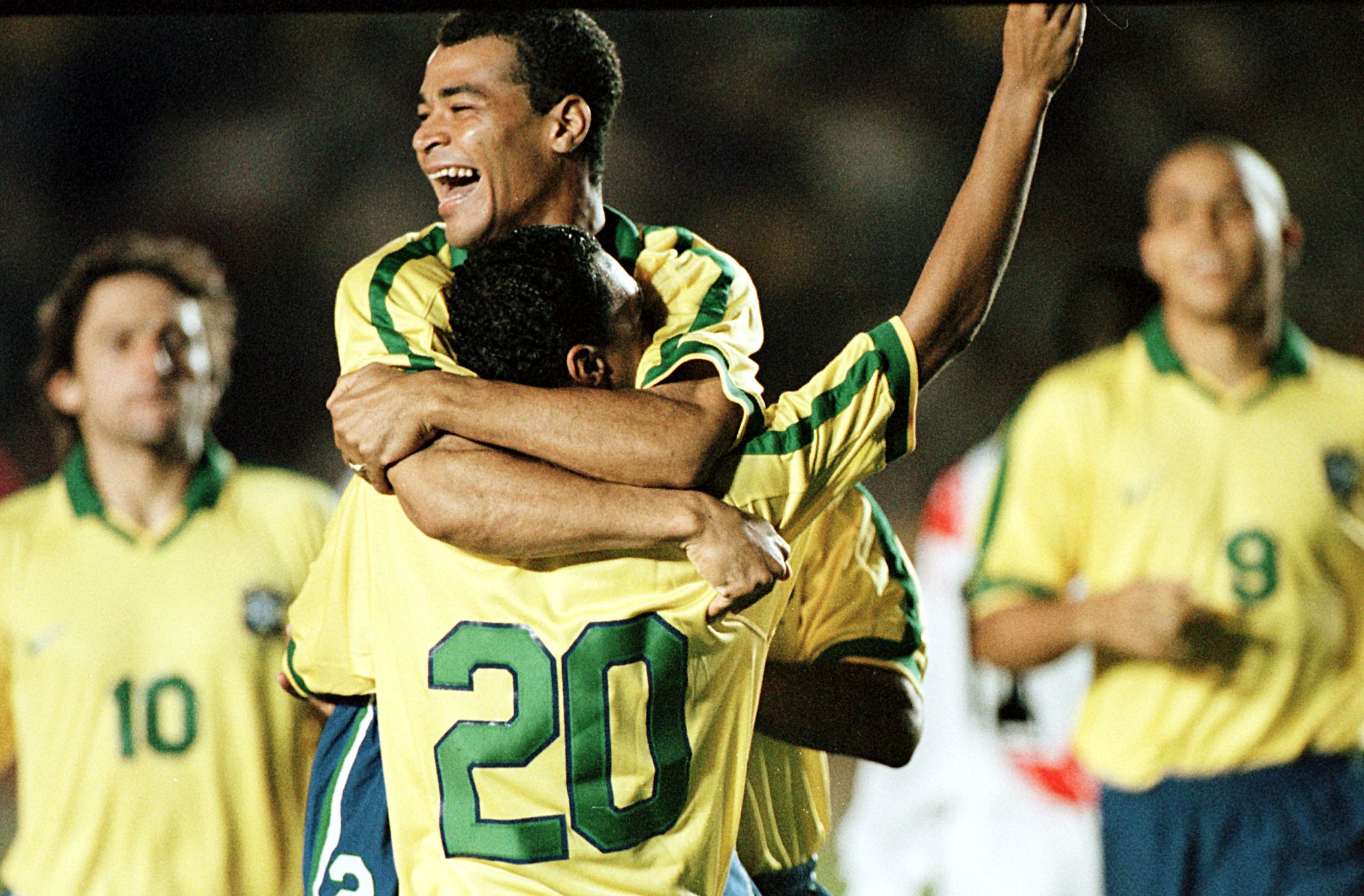 Denilson celebrates with Cafu after scoring for Brazil against Peru in the semi-finals of the 1997 Copa America.