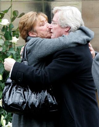 Anne Kirkbride, who played Deirdre Barlow, hugging her on screen husband William Roache