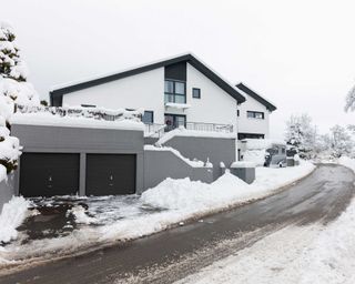 house and double garage on snowy road