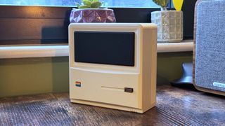 AyaNeo Retro Mini PC AM01 on a wooden home office desk