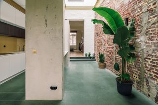 a home with a green concrete floor