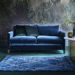 diamonds blue rug with velvet sofa