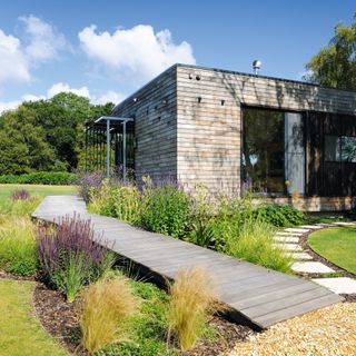 a timber clad mobile home in the New Forest