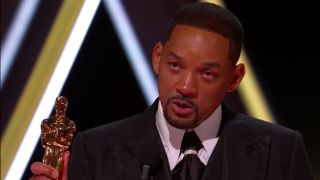 Will Smith holding his Oscar trophy at the 94th Academy Awards