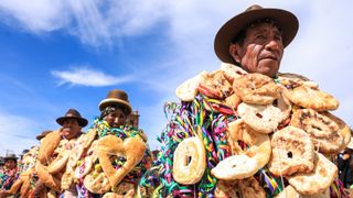 Members of the Aymara Indigenous group take part in a Rocasiri parade in Pomata, southern Peru