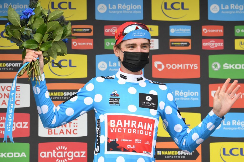 Team Bahrains Mark Padun of Ukraine celebrates his best climbers polka dot jersey on the podium at the end of the eighth stage on the final day of the 73rd edition of the Criterium du Dauphine cycling race a 147km between La LechereLesBains and Les Gets on June 6 2021 Photo by Alain JOCARD AFP Photo by ALAIN JOCARDAFP via Getty Images