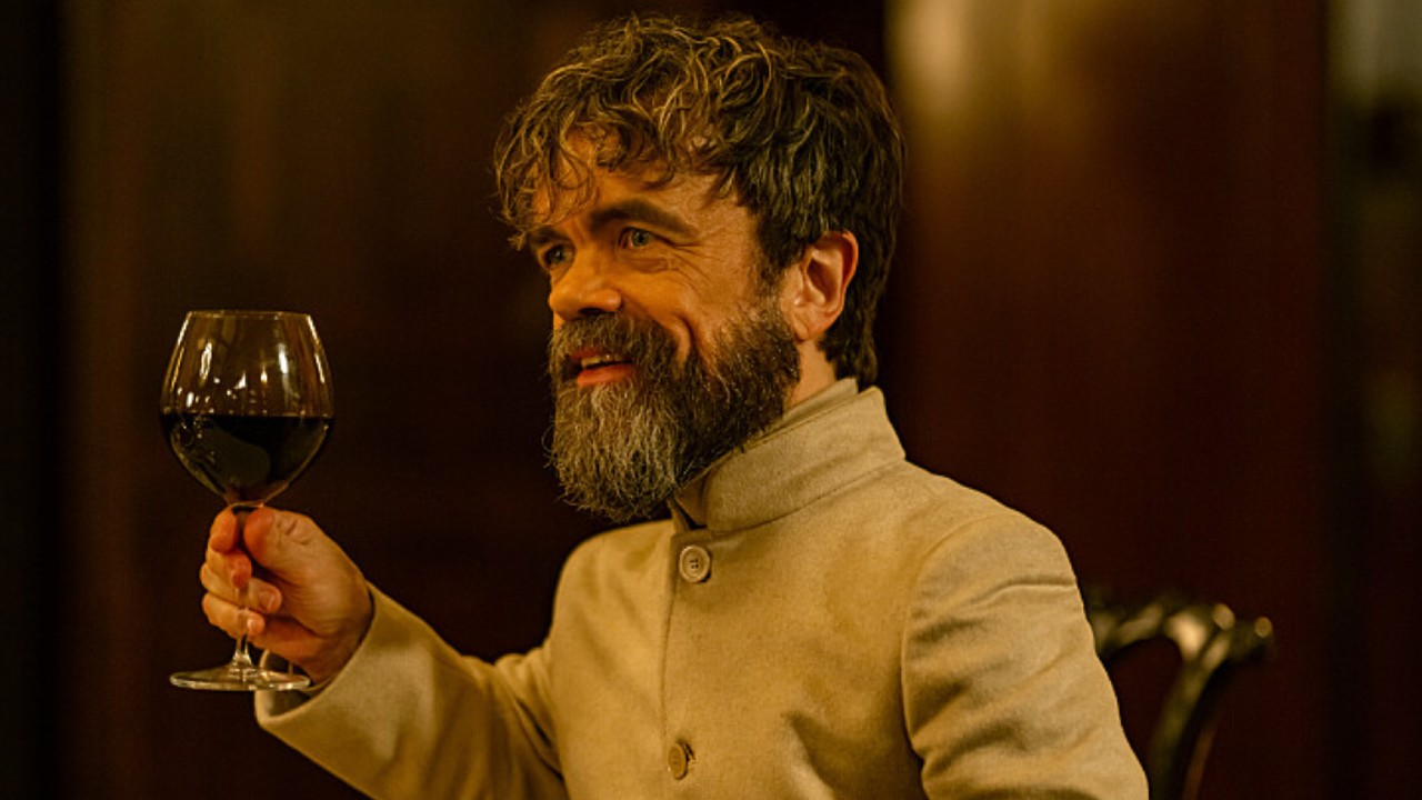 Prater offering a toast with a glass of wine