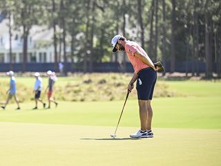 Adam Hadwin trying to read a putt on the green at Pinehurst No.2