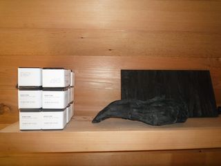 Stacks of cubes in white packaging on a wooden table photographed against a wooden background