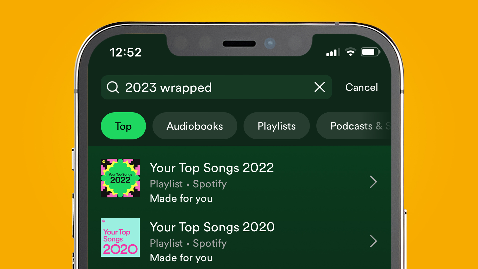 An iPhone on an orange background showing the search bar in the Spotify app