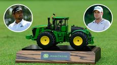 A John Deere Classic tee marker, with a player either side of it