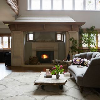 hall fireplace with sofa and cushions
