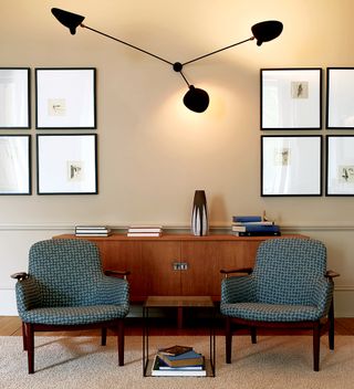 Scone’ lamp by Serge Mouille, Hans Wegner sideboard, ‘N 53’ lounge chairs by Arne Jacobsen and ‘PK 71’ nesting table by Poul Kjaerholm