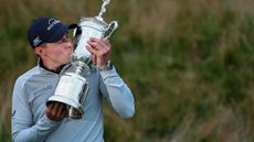 Matt Fitzpatrick kisses the trophy after winning the 2022 US Open