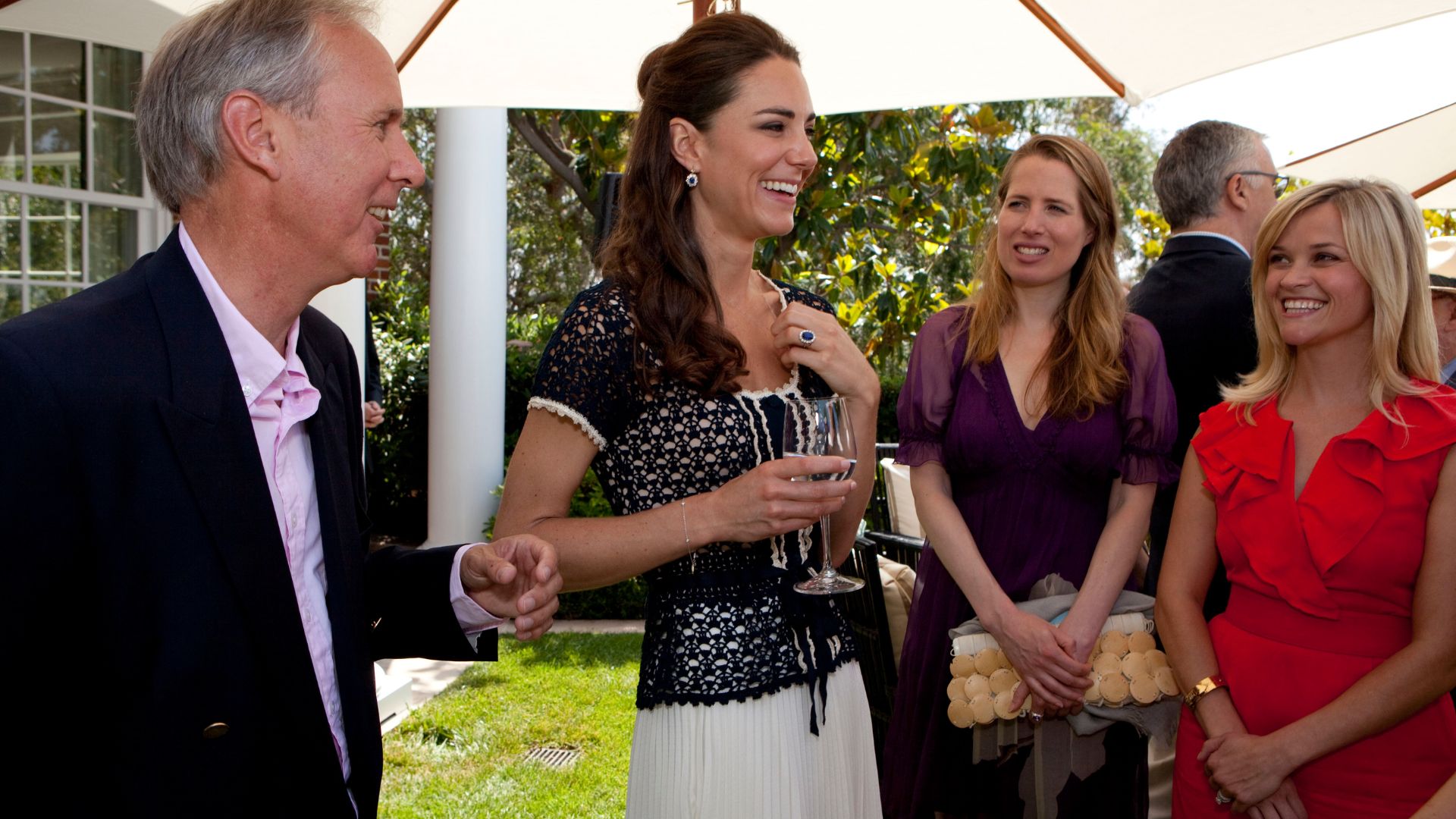 Kate Middleton talks with people including Reese Witherspoon