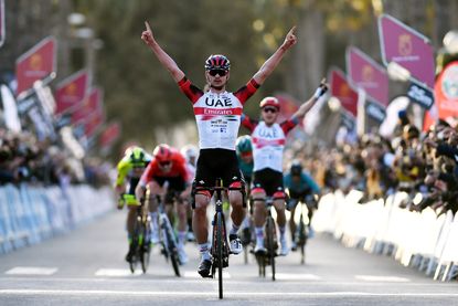 Alessandro Covi and Matteo Trentin celebrating at a race in Spain in 2022