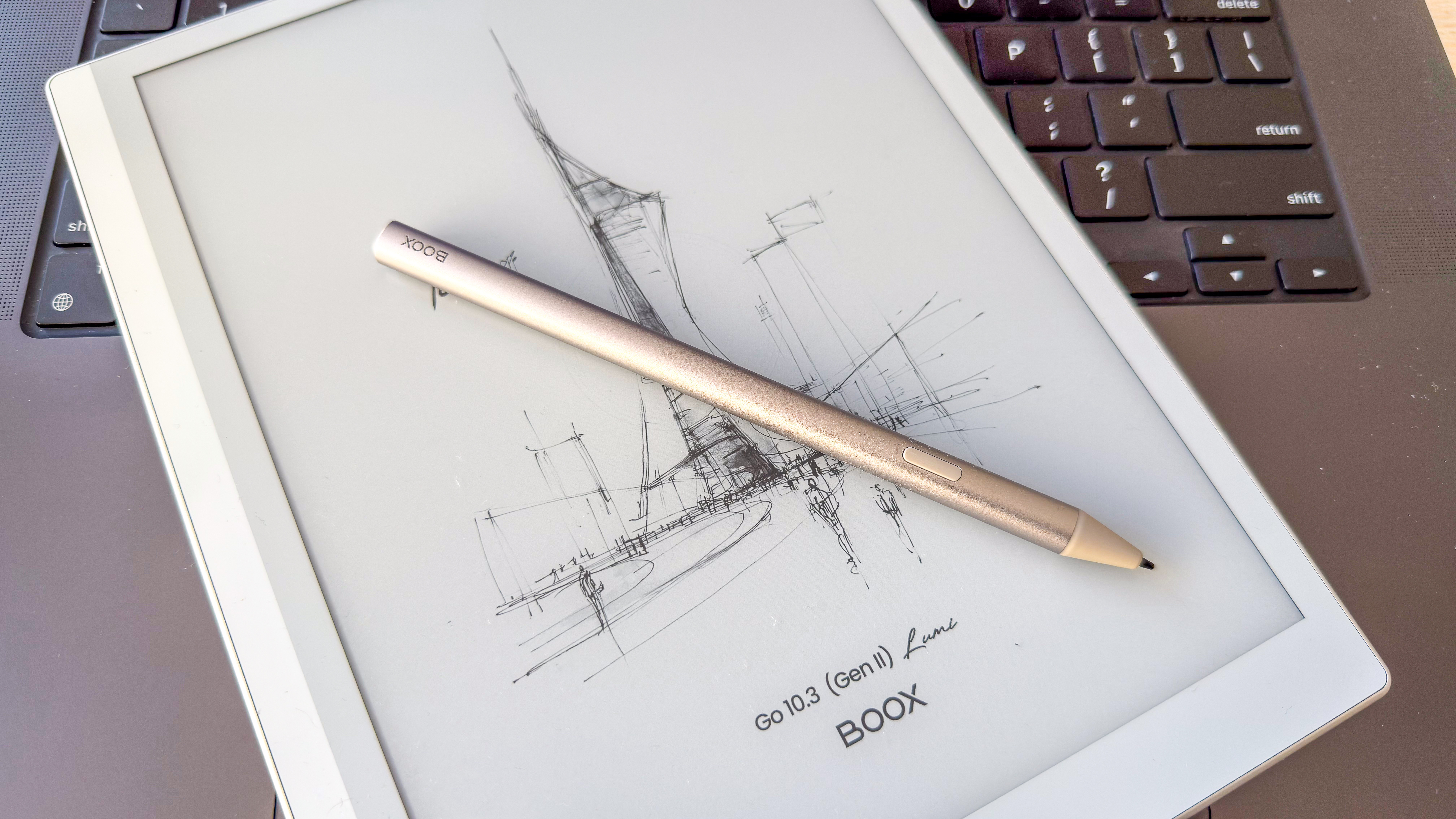 Boox Go 10.3 (Gen II) Lumi and its InkSense Plus stylus lying on a laptop