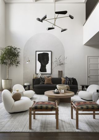 a living room with a large painted arch