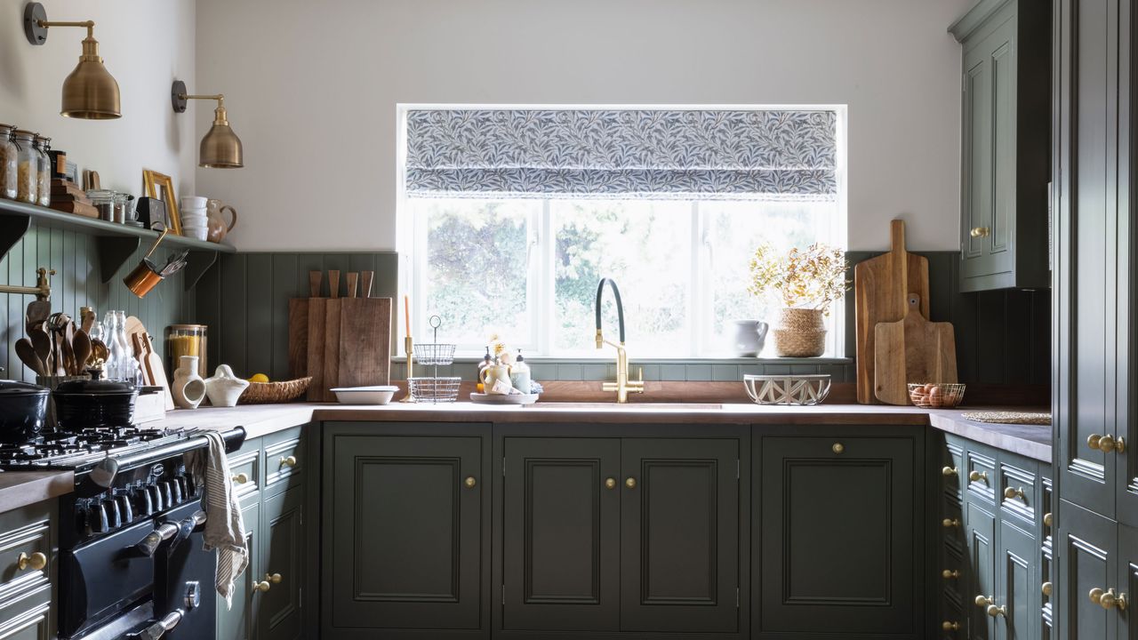 green kitchen with wood panelling