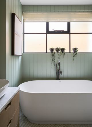 Small green panelled bathroom