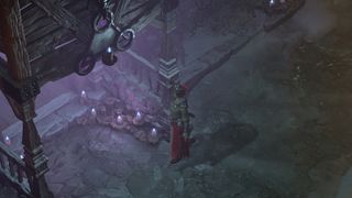 Diablo 4 item enchanting - a sorcerer is stood outside a shop which has a soft purple glow emanating from it