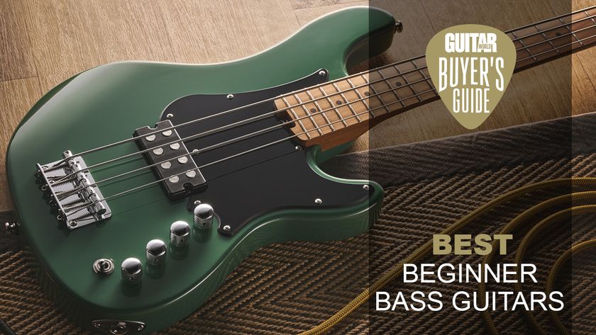 A Cort short scale bass guitar lying on a rug