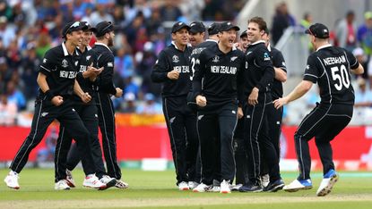 New Zealand players celebrate Martin Guptill’s superb run out of India’s MS Dhoni