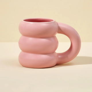 A pastel pink bubble mug with ridges
