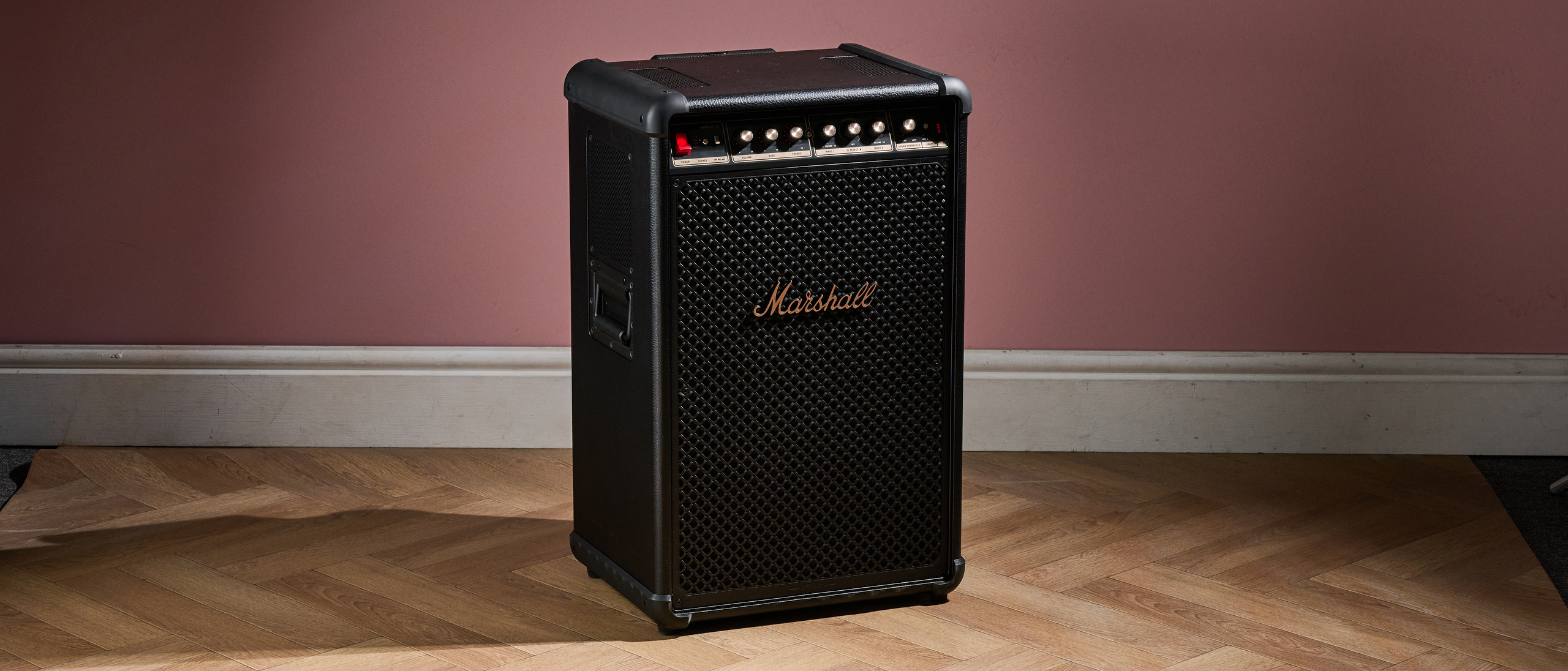 Marshall Bromley 750 on the floor against pink background