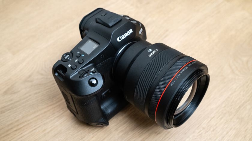 Canon RF 85mm f/1.2L USM attached to a Canon EOS R1 on a wood floor