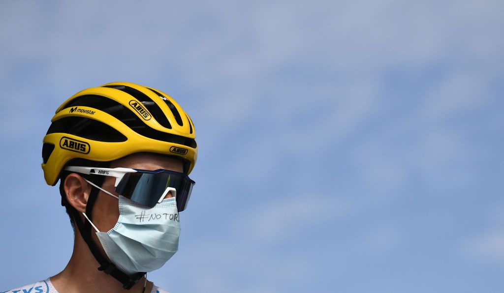 Team Movistar rider Spains Enric Mas wearing the best youngs white jersey waits prior to the 21st and last stage of the 107th edition of the Tour de France cycling race 122 km between ManteslaJolie and Champs Elysees Paris on September 20 2020 Photo by Marco Bertorello POOL AFP Photo by MARCO BERTORELLOPOOLAFP via Getty Images