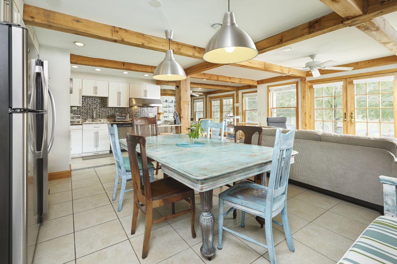 A dated dining room with a light blue dining table
