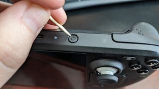 Using toothpick on Steam Deck power button.