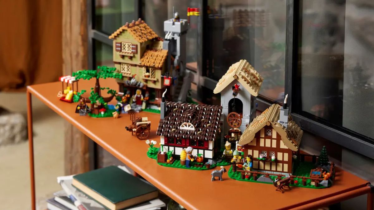 Lego Medieval Town Square buildings, lined up on a shelf