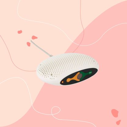 lakeland small dehumidifier on a pink square graphic background