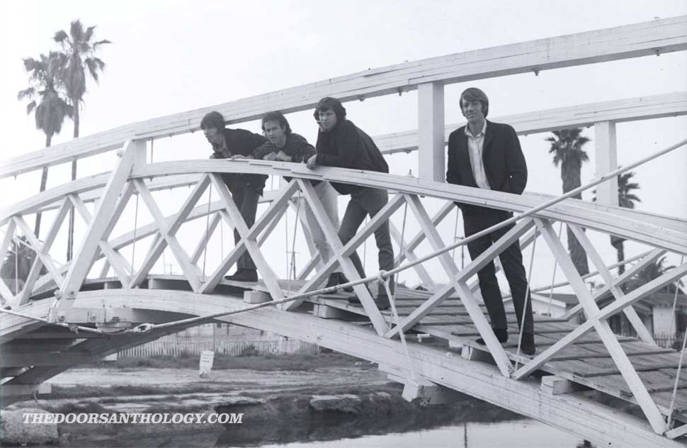 The Doors standing on a bridge