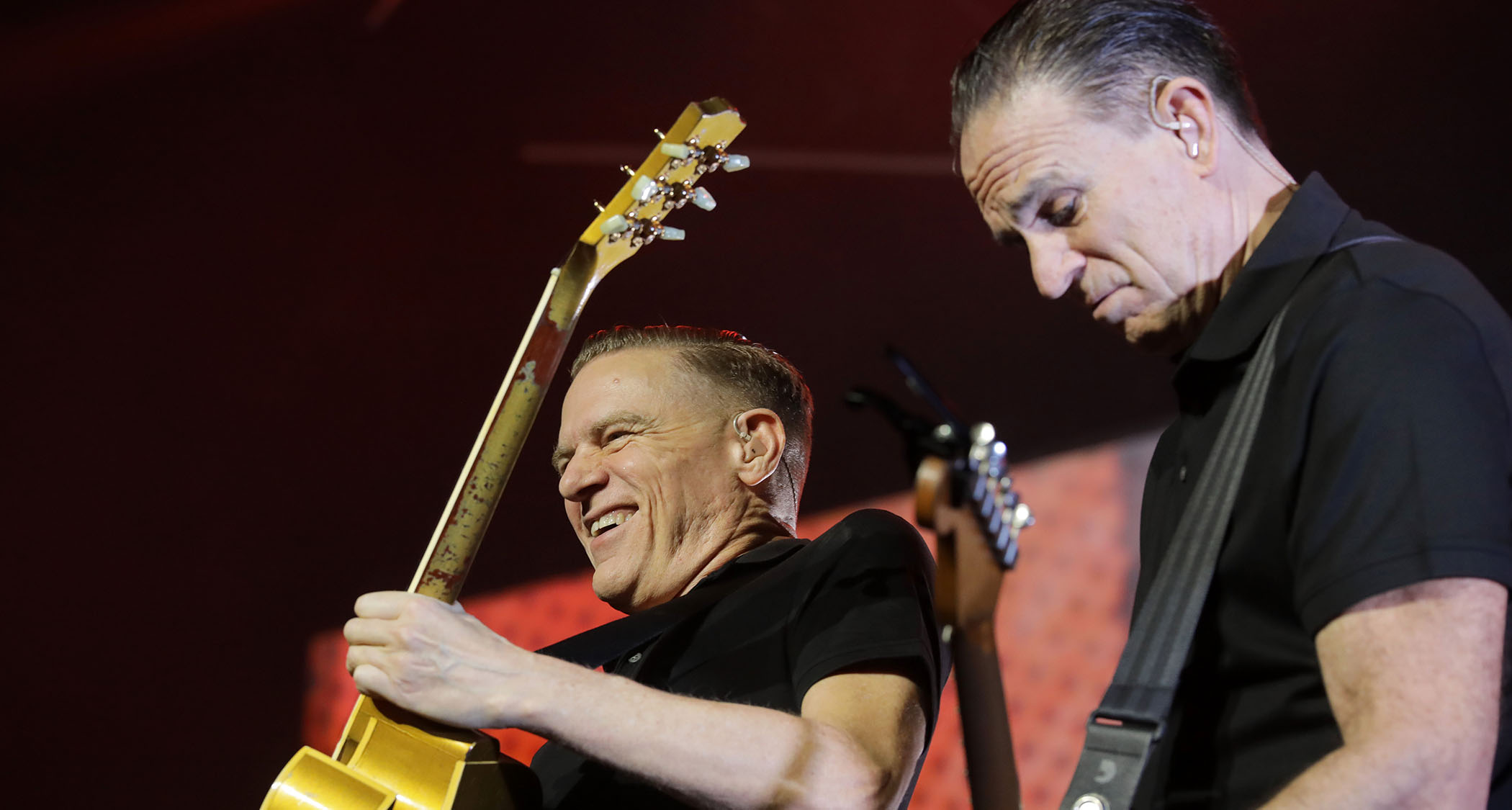 Bryan Adams and Keith Scott jam onstage during Adams' 2019 Shine A Light Tour in New Zealand.