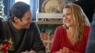 Alicia Silverstone and Oliver Hudson smile and laugh at each other 
