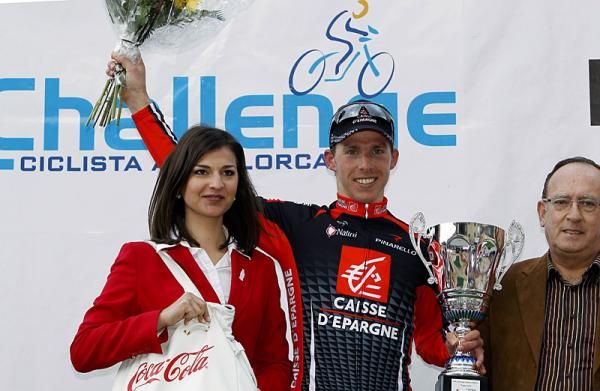Rui Costa (Caisse d'Epargne) receives his victor's flowers and trophy on the podium.