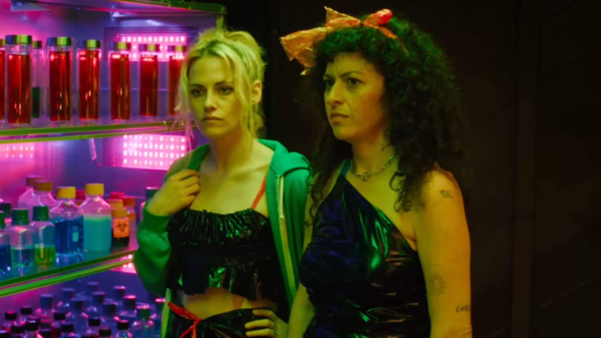 Kristen Stewart and Alia Shawkat wearing trash bag outfits in The Wrong Girls. 