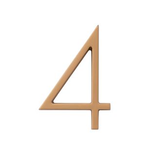 A modern house number in satin brass