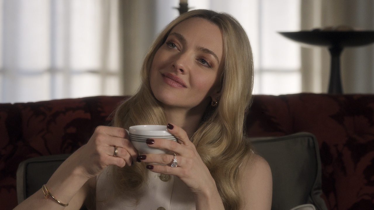 Amanda Seyfried as Nina with a cup of tea in The Housemaid