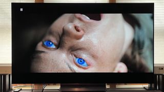 LG C4 OLED TV showing image of woman with blue eyes